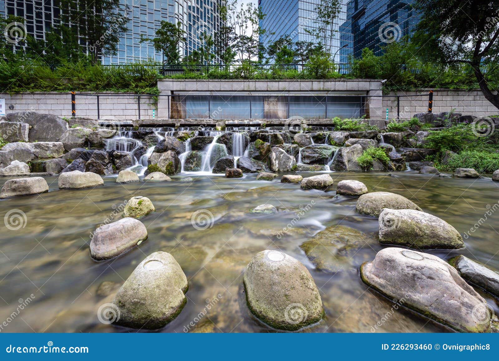 artificial waterfall and rocks in cheonggyecheon stream, seoul, south korea. long exposure